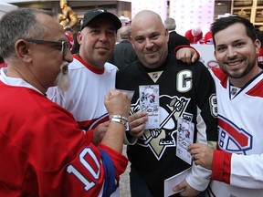 Daniel Simard, Patrick Lebeau, Claude Charbonneau and Jonathan Hamelin, all from Gatineau, show their season opener tickets prior to the Habs game on Tuesday October 18, 2016.