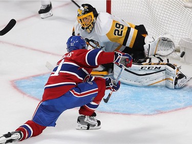 Montreal Canadiens centre David Desharnais (51) beats Pittsburgh Penguins goalie Marc-André Fleury for a goal during second period NHL action in Montreal on Tuesday October 18, 2016.