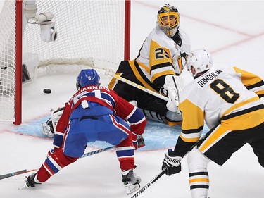 Montreal Canadiens centrer David Desharnais (51) scores on Pittsburgh Penguins goalie Marc-André Fleury with Brian Dumoulin (8) closing in, during third period NHL action in Montreal on Tuesday October 18, 2016.