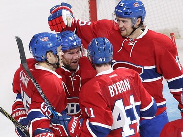 Montreal Canadiens centre David Desharnais (51) celebrates with teammates Andrew Shaw (65), Paul Byron (41) and Jeff Petry (26) during third period NHL action in Montreal on Tuesday October 18, 2016.