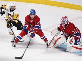 Montreal Canadiens defenceman Mikhail Sergachev (22) takes puck away from Pittsburgh Penguins centre Matt Cullen (7) in front of goalie Al Montoya during first period NHL action in Montreal on Tuesday October 18, 2016.