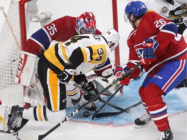 Montreal Canadiens goalie Al Montoya stops puck on Pittsburgh Penguins right wing Tom Kuhnhackl (34) while Montreal Canadiens defenceman Jeff Petry (26) comes in on play, during second period NHL action in Montreal on Tuesday October 18, 2016.