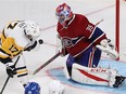 Montreal Canadiens goalie Al Montoya stops puck on Pittsburgh Penguins Brian Rust during third period NHL action in Montreal on Tuesday October 18, 2016.