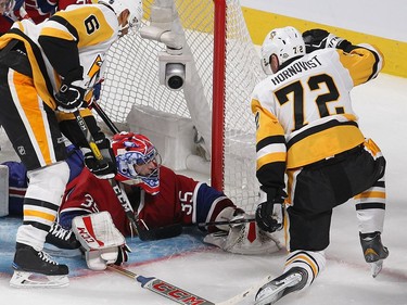 Montreal Canadiens goalie Al Montoya looks back at right wing Patric Hornqvist (72) and Trevor Daley (6) during third period NHL action in Montreal on Tuesday October 18, 2016.