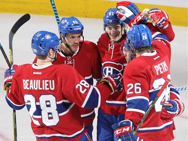 Montreal Canadiens Nathan Beaulieu (28), Andrew Shaw (65), Max Pacioretty, Jeff Petry (26) celebrate the goal of David Desharnais (51) during second period NHL action in Montreal on Tuesday October 18, 2016.