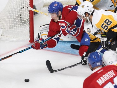 Montreal Canadiens right wing Brendan Gallagher (11) and Pittsburgh Penguins defenceman Kris Letang (58) fight for the puck near the Penguins net during first period NHL action in Montreal on Tuesday October 18, 2016.