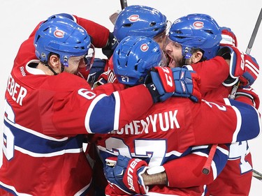 Montreal Canadiens right wing Alexander Radulov, far right, celebrates his goal with teammates Shea Weber (6), Alex Galchenyuk (27), Andrei Markov (79) during third period NHL action in Montreal on Tuesday October 18, 2016.
