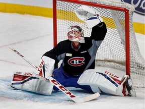 Montreal Canadiens goalie Carey Price makes a glove save during a team practice at the Bell Centre in Montreal on Wednesday October 19, 2016.