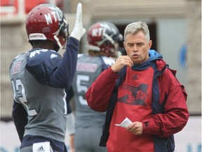 Alouettes head coach Jacques Chapdelaine, right, with quarterback Rakeem Cato during warmup prior to game against the Toronto Argonauts in Montreal on Sunday Oct. 2, 2016.