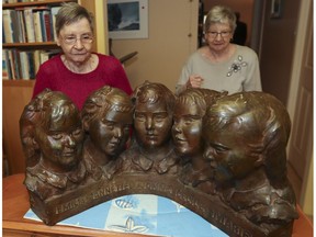 Cécile (left) and Annette Dionne, the two surviving Dionne quintuplets, born in Ontario in 1934, at the St. Bruno home of of Annette with a casting of themselves and their sisters. Cécile is living in the Montreal area under curatorship.