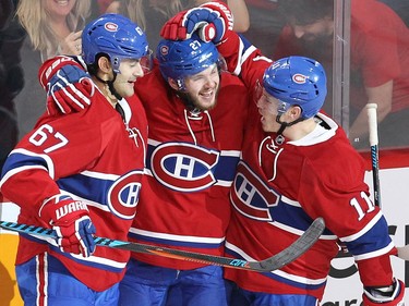Montreal Canadiens centre Alex Galchenyuk (27) celebrates his goal with Max Pacioretty (67) and Brendan Gallagher (11) during second period NHL action in Montreal on Thursday October 20, 2016.