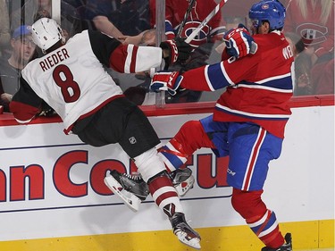 Montreal Canadiens defenceman Shea Weber (6) puts Arizona Coyotes centre Tobias Rieder (8) into the boards during first period NHL action in Montreal on Thursday October 20, 2016.