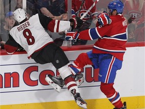 Montreal Canadiens defenceman Shea Weber puts Arizona Coyotes center Tobias Rieder into the boards during first period NHL action in Montreal on Thursday October 20, 2016.