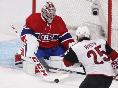 Montreal Canadiens goalie Carey Price stops puck in front of Arizona Coyotes centre Ryan White (25) during first period NHL action in Montreal on Thursday October 20, 2016. Price is playing in his first regular season game.