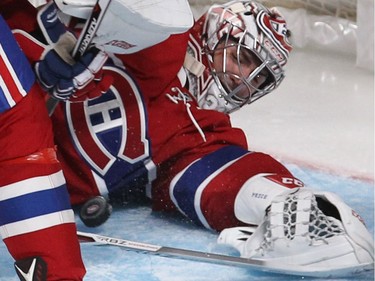 Montreal Canadiens goalie Carey Price stops puck with body during third-period NHL action in Montreal on Thursday, Oct. 20, 2016.