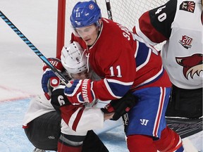 Montreal Canadiens right wing Brendan Gallagher (11) puts a headlock on Arizona Coyotes's Jakob Chychrun (6) during second period NHL action in Montreal on Thursday October 20, 2016.