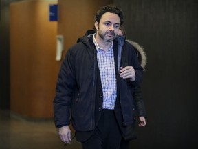 Maxime Roussy, author of books for teenagers, heads to court at the Palais de Justice in Montreal on Wednesday, Oct. 26, 2016.