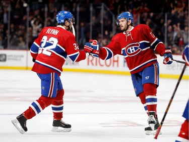 Montreal Canadiens centre Torrey Mitchell, right, celebrates with Montreal Canadiens centre Brian Flynn after scoring against Tampa Bay Lightning goalie Ben Bishop during NHL action at the Bell Centre in Montreal on Thursday October 27, 2016.