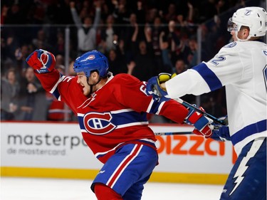 Montreal Canadiens centre Andrew Shaw celebrates as they score against Tampa Bay Lightning goalie Ben Bishop during NHL action at the Bell Centre in Montreal on Thursday October 27, 2016. Tampa Bay Lightning defenceman Andrej Sustr looks on.