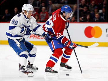 Tampa Bay Lightning centre Vladislav Namestnikov, left, holds back Montreal Canadiens centre Brian Flynn during NHL action at the Bell Centre in Montreal on Thursday October 27, 2016. A penalty was called on the play.