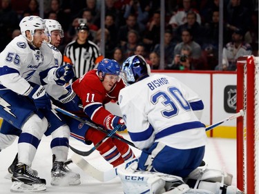 Tampa Bay Lightning defenceman Braydon Coburn, left, and Tampa Bay Lightning centre Tyler Johnson keep Montreal Canadiens right wing Brendan Gallagher from making it to Tampa Bay Lightning goalie Ben Bishop during NHL action at the Bell Centre in Montreal on Thursday October 27, 2016.