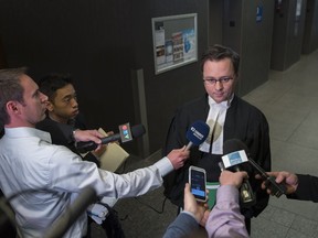 Lawyer Sébastien Pierre-Roy, who is representing La Presse, speaks to reporters at the Montreal courthouse on Monday, October 31, 2016. Lawyers from La Presse were attempting to obtain documents pertinent to a 24 surveillance warrant on journalist Patrick Lagacé by SPVM police.
