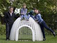Eric Villiard, left, poses with his wife, Stephanie Doyle, and sons Hugo (second from left) and Thomas by the plastic igloo he has designed.