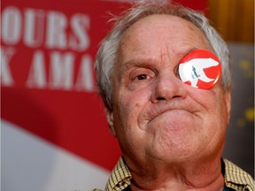 Festival du nouveau cinéma programming director Claude Chamberlan clowns with photographers on the red carpet at the Festival du nouveau cinema in Montreal on Wednesday Oct. 5, 2016.