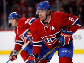 Montreal Canadiens defenceman Shea Weber, right, waits for a puck drop during preseason NHL action against the Toronto Maple Leafs at the Bell centre in Montreal on Thursday October 6, 2016. Montreal Canadiens right wing Michael McCarron is seen at rear.