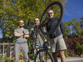 Nicolas Goupil (from left), Pierre Laplante and Loïc Dehoux of Picolo Vélo, with a prototype bike made from wood in Montreal, Friday September 30, 2016.