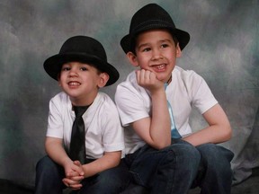 Noah Barthe, left, and Connor Barthe pose in this undated photo posted on the Facebook page of Mandy Trecartin.The RCMP say one person has been arrested in connection with the deaths of two young boys who were asphyxiated by a python in Campbellton, N.B., in August 2013.