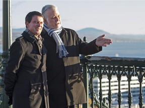 Quebec Premier Philippe Couillard, right, and the Prime Minister of France Manuel Valls on Dufferiin terrace overlooking the St. Lawrence river, Friday, Oct. 14, 2016 in Quebec City.