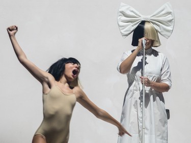 Australian musician Sia Furler, right, performs as part of her Nostalgic for the Present Tour at the Bell Centre in Montreal on Sunday, Oct. 23, 2016.