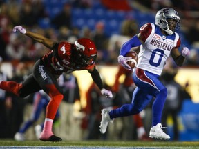 Montreal Alouettes' Stefan Logan, right, outruns Calgary Stampeders' Shaquille Richardson during second half CFL football action in Calgary, Saturday, Oct. 15, 2016.