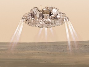 This artist impression provided by the European Space Agency, ESA, shows the Schiaparelli module with thrusters firing.
