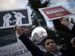 Thousands of people gather in solidarity outside Zaman newspaper in Istanbul, Friday, March 4, 2016 after a local court ordered that Turkey's largest-circulation, opposition newspaper, which is linked to a U.S.-based Muslim cleric, be placed under the management of trustees - a move that heightens concerns over deteriorating press freedoms in Turkey.