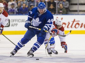 Toronto Maple Leafs Morgan Rielly and Montreal Canadiens Jeremiah Addison in 2nd period action at the Air Canada Centre in Toronto, Ont.  on Sunday Oct. 2, 2016.