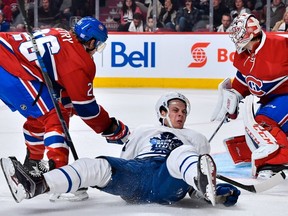 Jeff Petry (26) of the Montreal Canadiens takes down Auston Matthews (34) of the Toronto Maple Leafs during the NHL game at the Bell Centre on Saturday, Oct. 29, 2016, in Montreal.