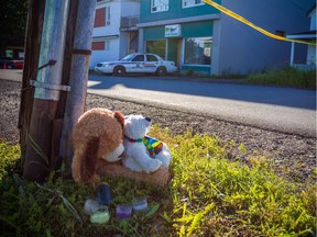 A 2013 memorial outside the Reptile Ocean exotic pet store in Campbellton, N.B., after an African rock python escaped and strangled two young boys.