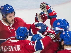 Canadiens' Paul Byron, centre, celebrates with teammates Alexander Radulov (47), Alex Galchenyuk (27), Shea Weber (6) and Alexei Emelin (74) after scoring against the Toronto Maple Leafs during first period NHL hockey action in Montreal, Saturday, Nov. 19, 2016.