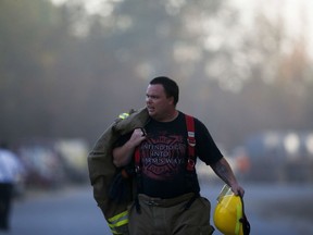 An Alabaster firefighter near the scene of an explosion of a Colonial Pipeline, Oct. 31, 2016, in Helena, Ala. Colonial Pipeline shut down its main pipeline in Alabama after the explosion in a rural part of the state outside Birmingham.