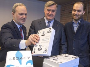 Author and senator, André Pratte, left, former Quebec premier Lucien Bouchard, center, and Antoine Dionne Charest, son of former Quebec premier Jean Charest, attend the launch of the book Legacy: How French Canadians shaped North America, on Monday, November 14, 2016.