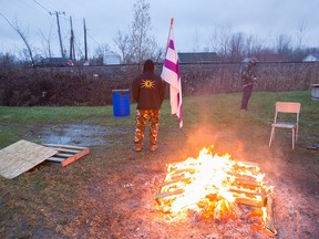 Anti-pipeline protesters camp near a railway crossing in Kahnawake. They're refusing to let trains pass, causing the Agence métropolitaine de transport’s Candiac line to be suspended for the morning rush hour Nov. 16, 2016.