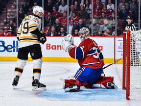 Matt Beleskey #39 of the Boston Bruins and Carey Price #31 of the Montreal Canadiens watch as the puck enters the net during the NHL game at the Bell Centre on November 8, 2016 in Montreal.