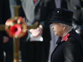 Britain's Queen Elizabeth II takes part in the Remembrance Sunday service at the Cenotaph in London, Sunday, Nov.13, 2016.