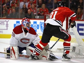 Marian Hossa of the Chicago Blackhawks slips the puck past Al Montoya of the Montreal Canadiens to score a second-period goal at the United Center on Nov. 13, 2016, in Chicago.