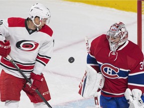 Montreal Canadiens goaltender Carey Price makes a save against Carolina Hurricanes' Jay McClement during first period NHL hockey action in Montreal, Thursday, November 24, 2016.