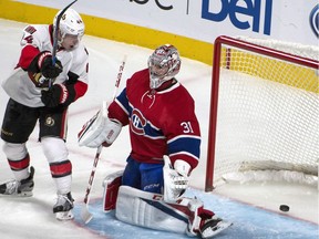 The shot by Ottawa Senators Erik Karlsson enters the net behind Montreal Canadiens goalie Carey Price as Ottawa Senators' Jean-Gabriel Pageau looks on during third period NHL hockey action on Tuesday.