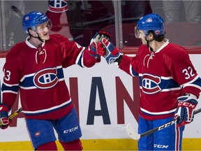 Montreal Canadiens' Daniel Carr, left, celebrates his goal past Los Angeles Kings goalie Peter Budaj with teammate Brian Flynn during first period NHL hockey action Thursday, November 10, 2016 in Montreal.