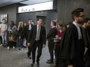 Former Montreal Mayor Michael Applebaum, centre, arrives with his lawyer Pierre Teasdale, rear, for his corruption trial at the Montreal Courthouse on Monday, November 14, 2016.